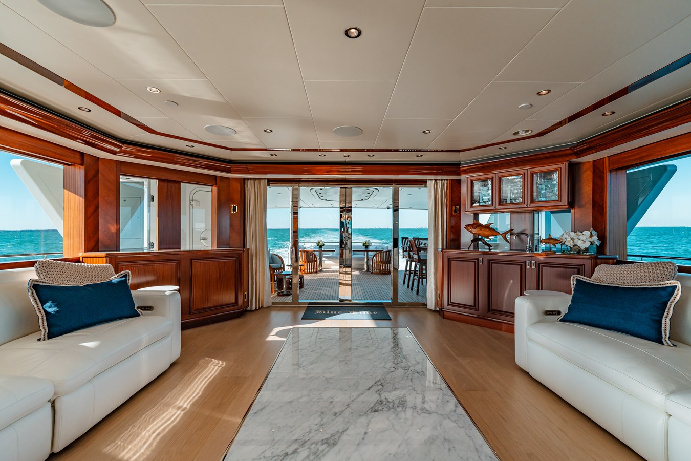 Westport 130 Blue Time main salon bar with mahogany cabinetry