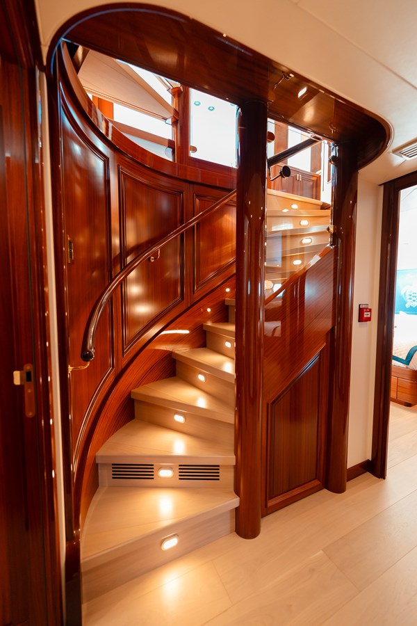 Westport 130 Blue Time curved mahogany staircase with LED lighting