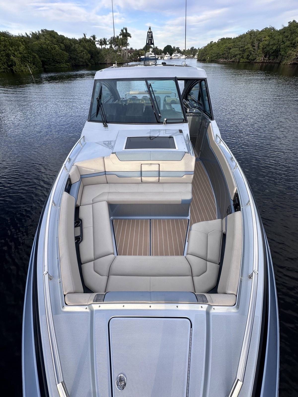 Formula 430 SSC elevated bow view showing cockpit seating and teak decking