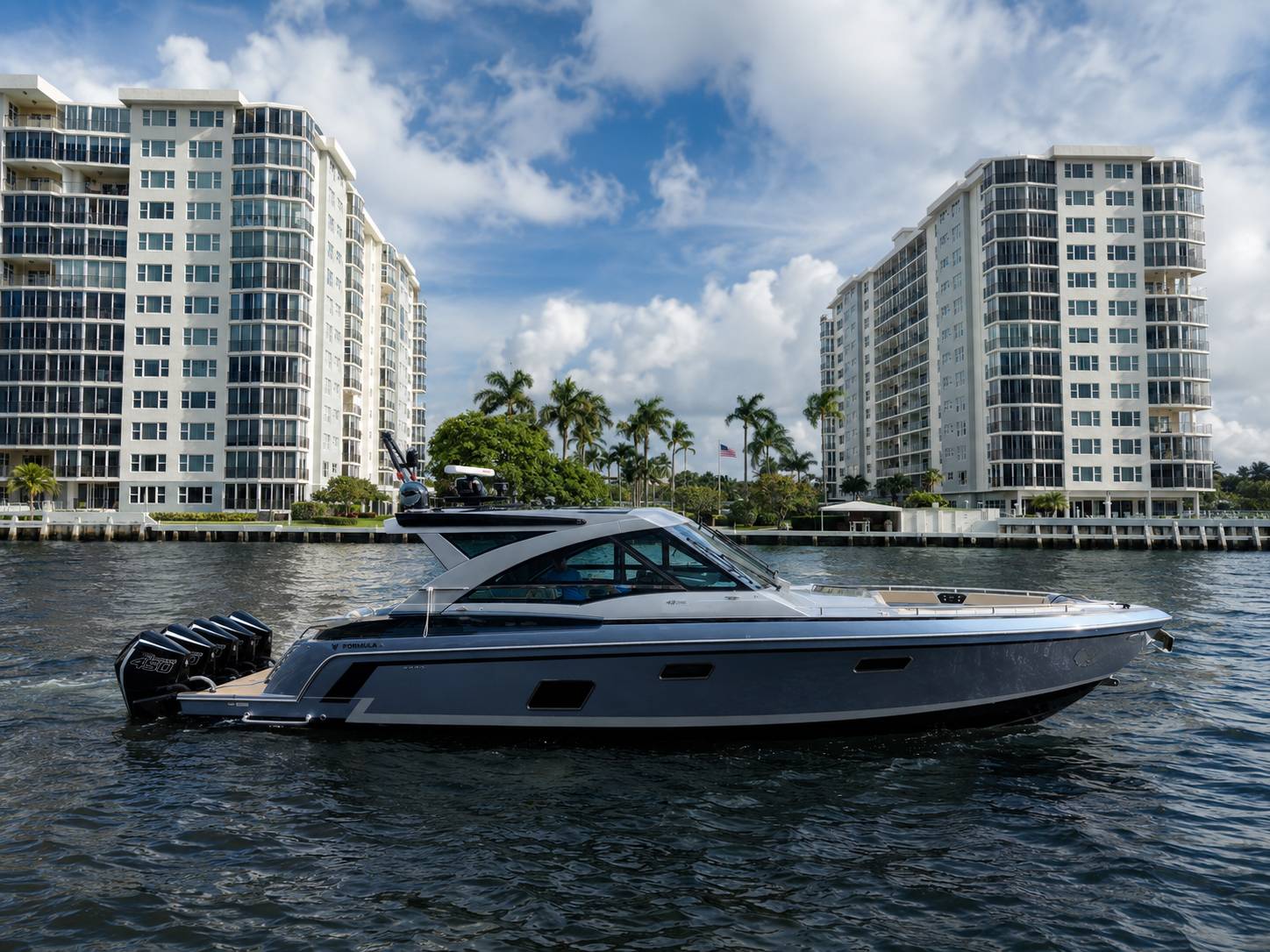2020 Formula 430 SSC port profile showing gunmetal grey hull in Fort Lauderdale waterway