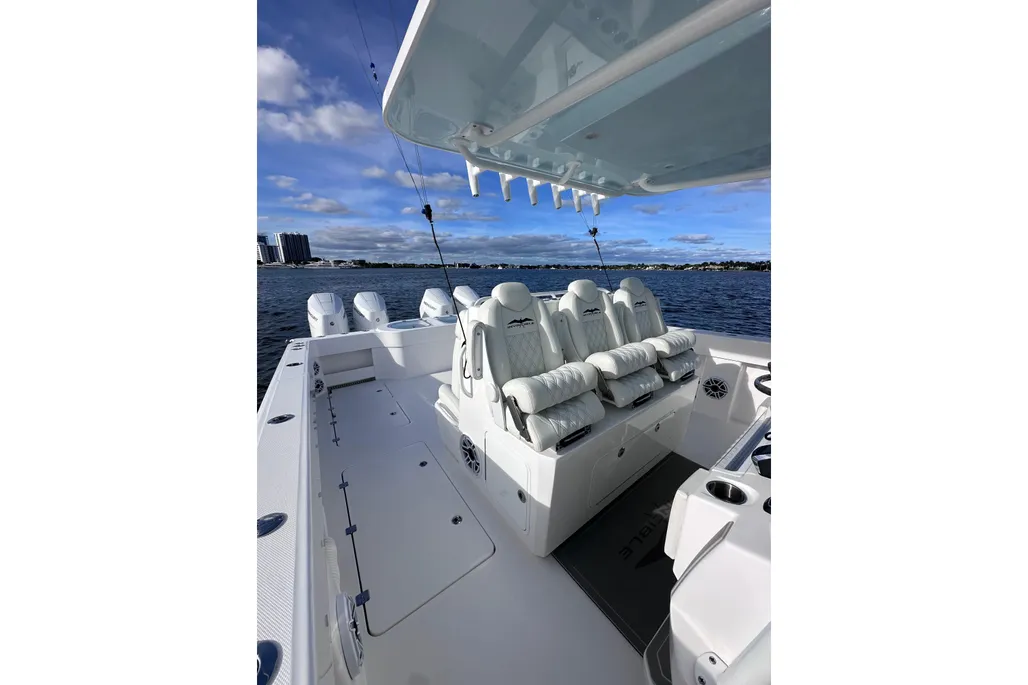 Invincible 40 Catamaran cockpit overview from aft showing fishing deck and outriggers