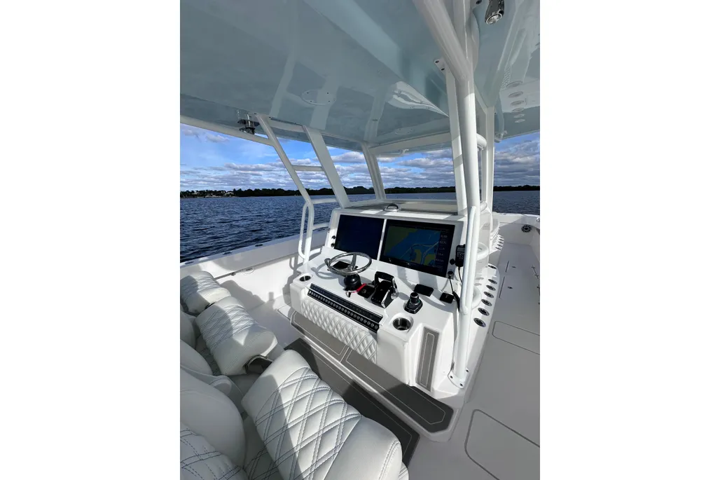 Invincible 40 Catamaran helm station side view with Garmin screens and quilted seats