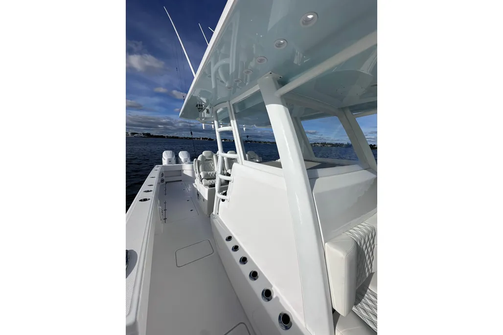 Invincible 40 Catamaran port side view with hardtop and rod holders