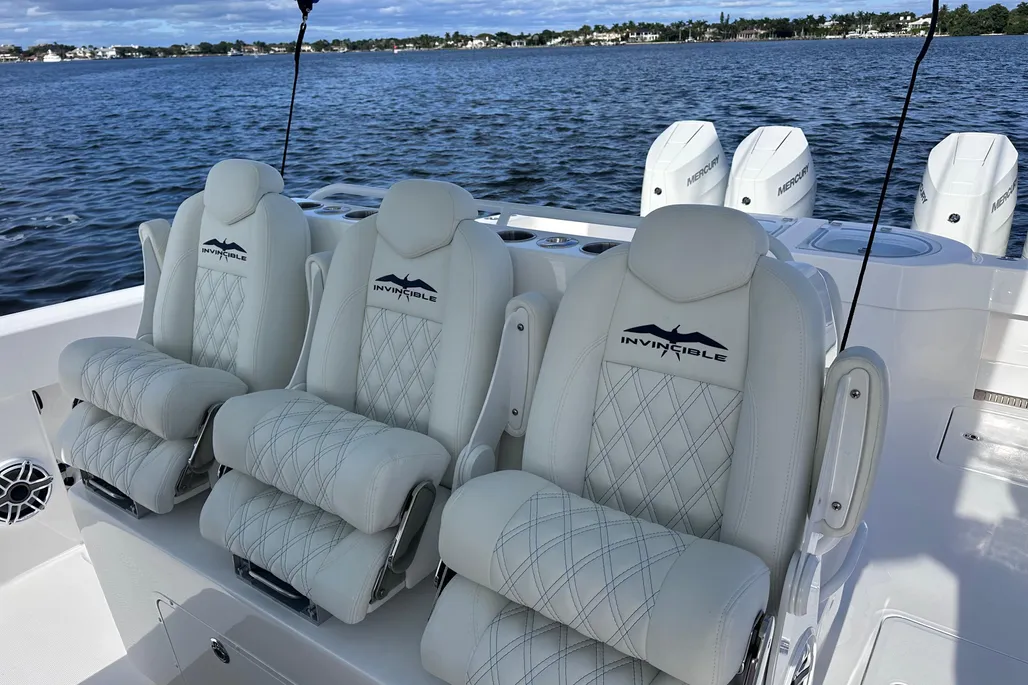 Invincible 40 Catamaran triple Invincible-branded helm seats with Mercury outboards