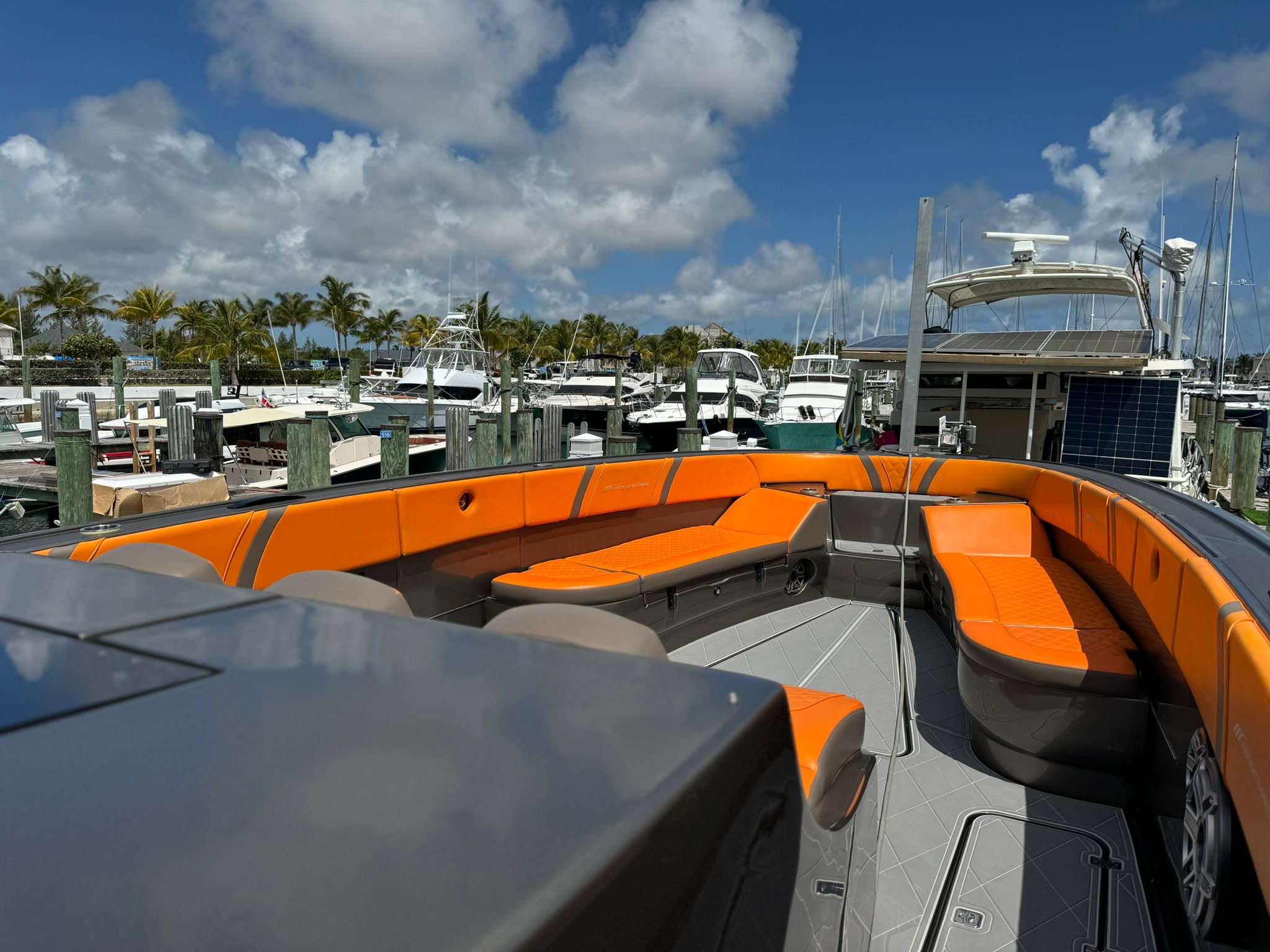 Midnight Express 43 Stop the Press forward bow lounge seating with orange upholstery in Nassau