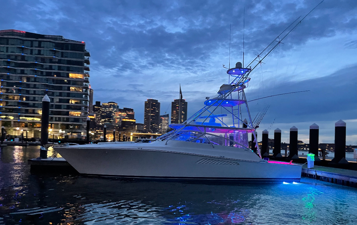 Viking 45 Open The Wroe Boat illuminated at night dockside Hyannis harbor