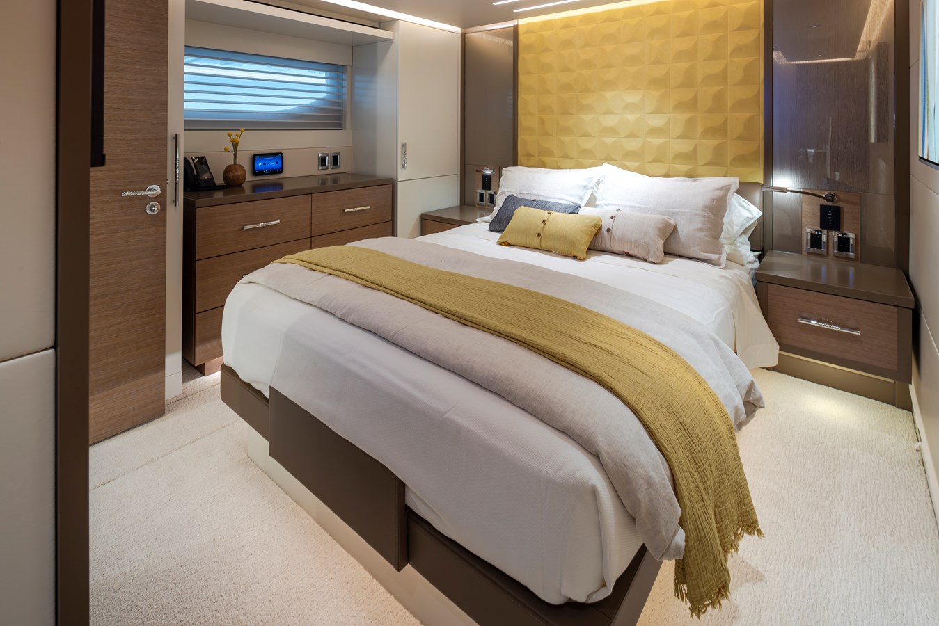 Westport W117 guest cabin with gold textured headboard and queen bed