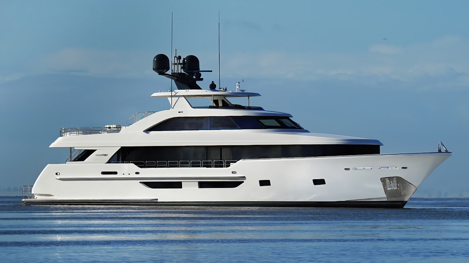 2025 Westport W117 motor yacht starboard profile cruising at sea