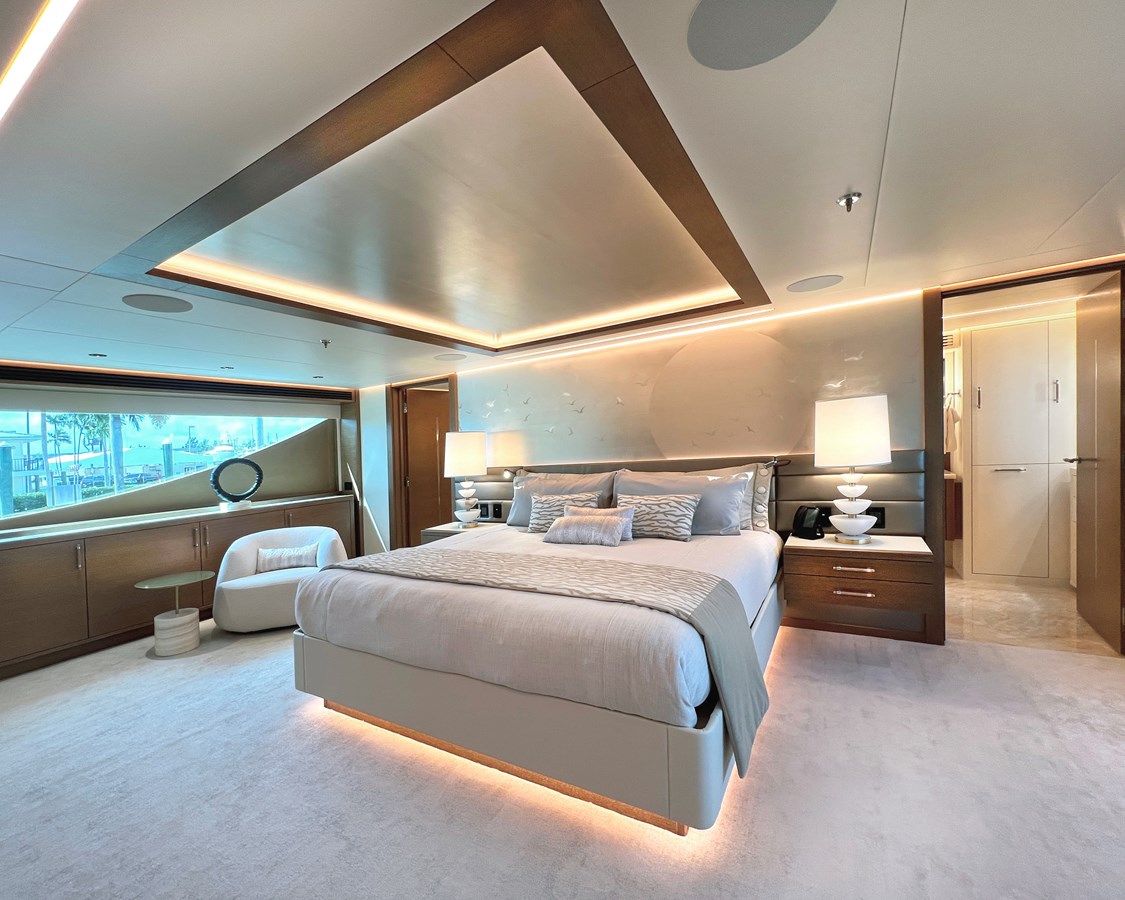 Westport W135 full-beam master stateroom with king bed and ambient LED lighting